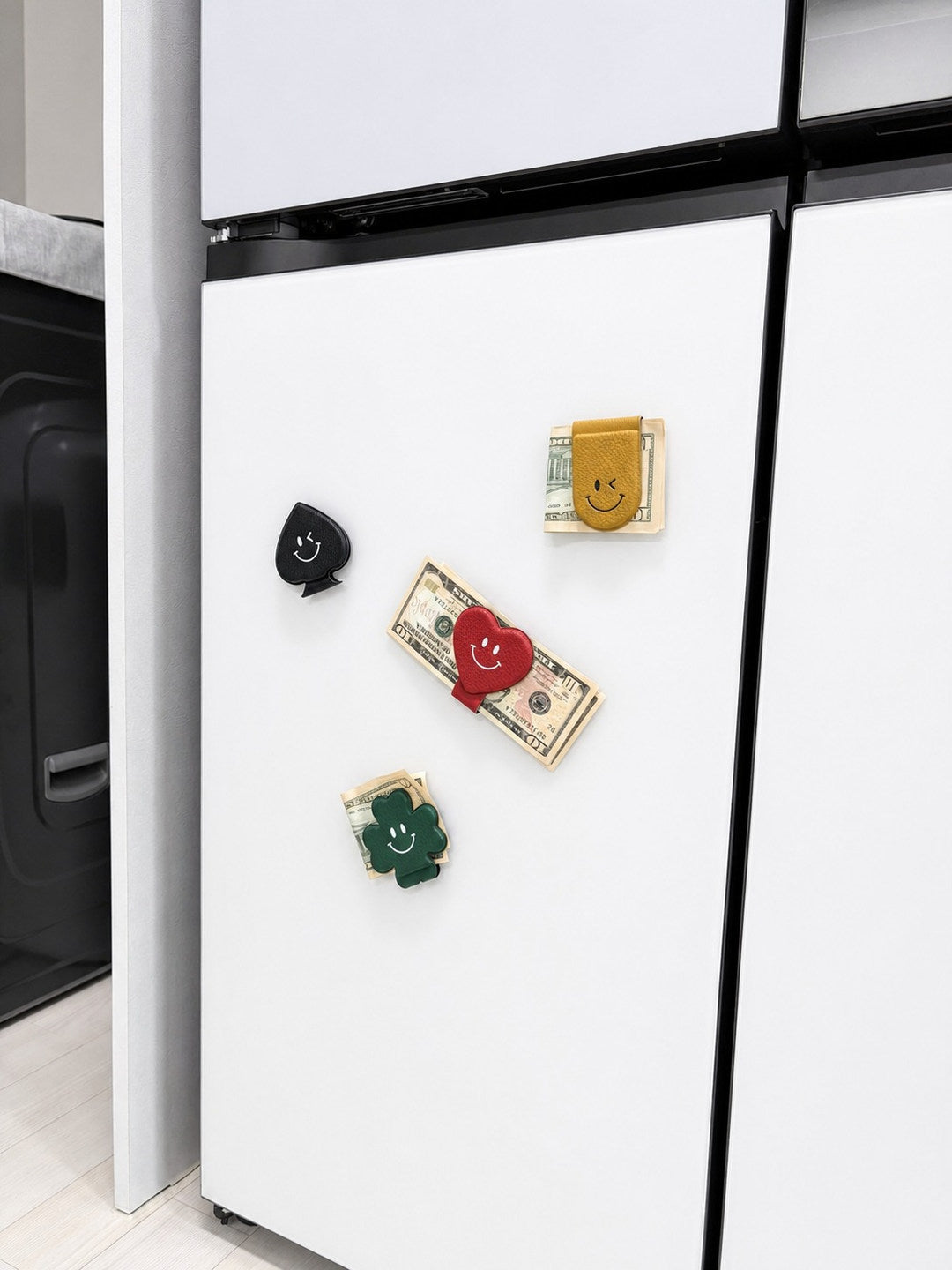 Refrigerator context showing four money clips