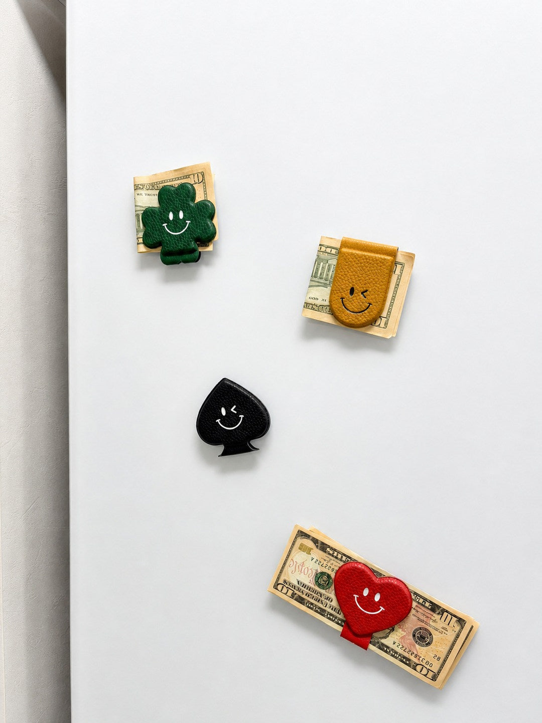 Smile Magnet Money Clips used on a refrigerator